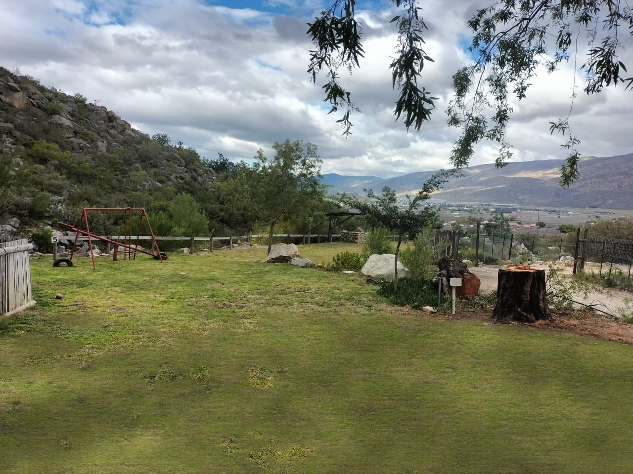 Campsite 5, the green space, with swings and a seesaw