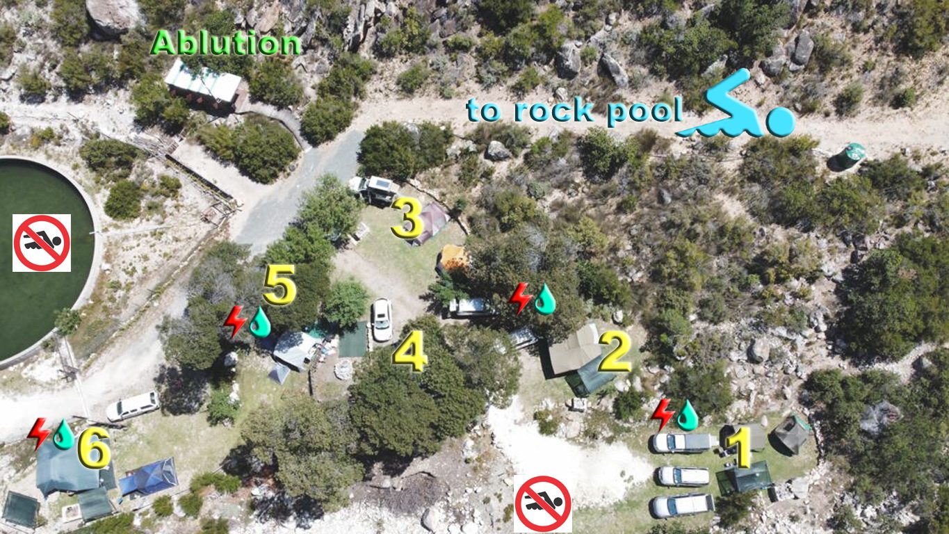 Aerial map of Ruah Camping with numbered sites, the ablution block and the path to the rock pool